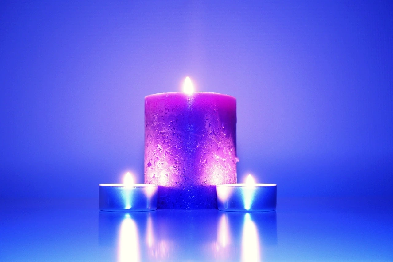 Three lit candles